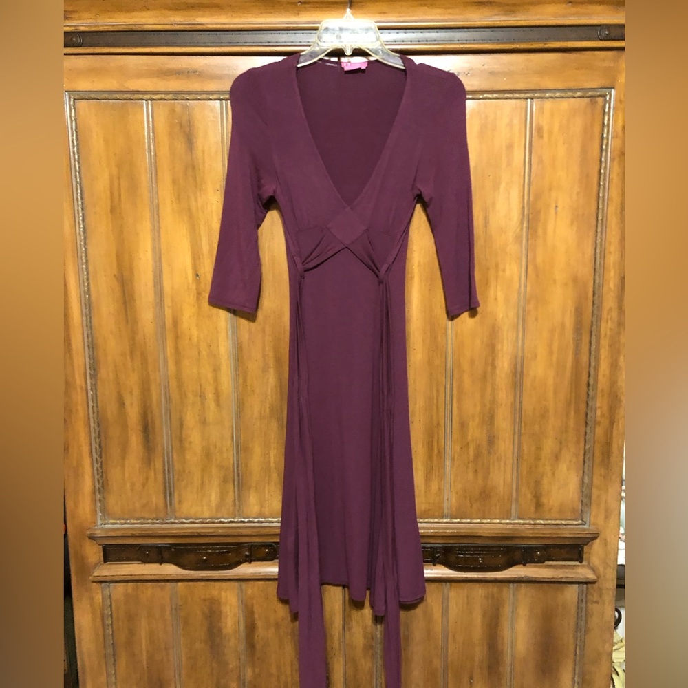 BCBGirls Burgundy, long sleeve dress.Wrap Belt. Good Condition. Size: XS.